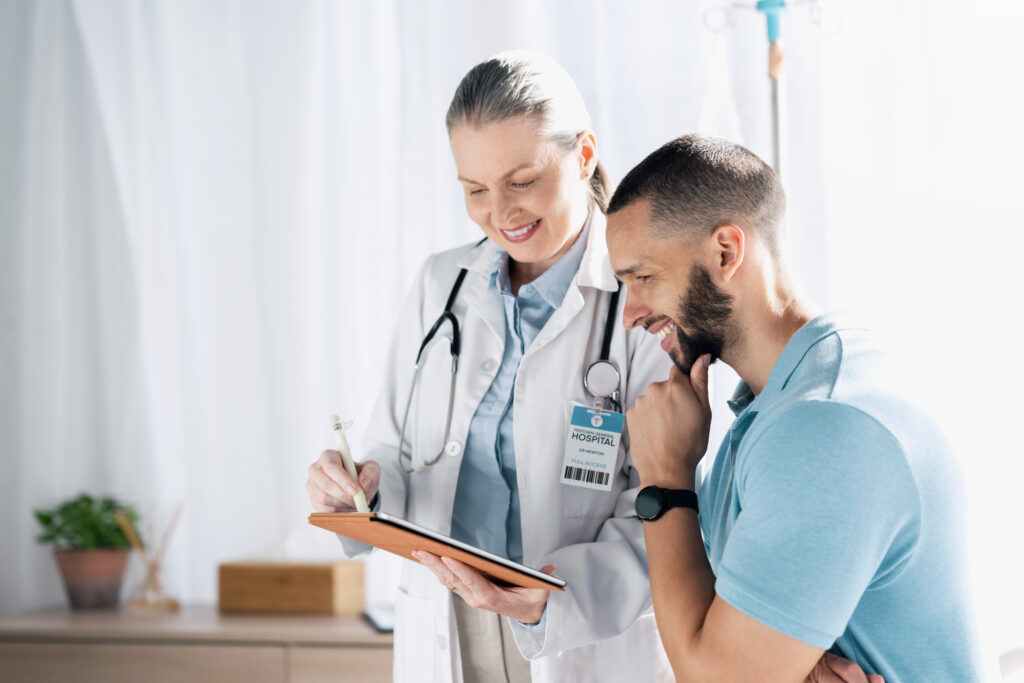 Doctor, patient and tablet for healthcare consultation, hospital support and feedback or online results. Medical professional and happy man with digital x ray, charts or technology for clinic advice.