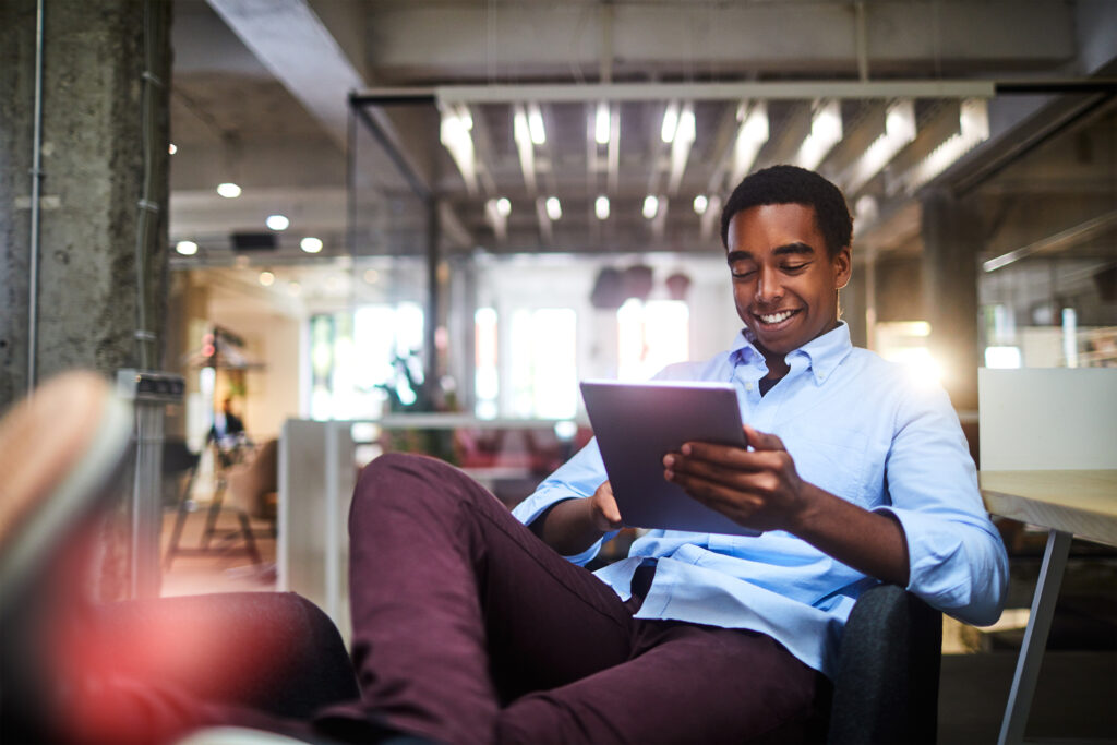 "Discover the insights of a successful businessman as he analyzes market trends on his tablet. Stay ahead in the business world with expert strategies and innovative solutions